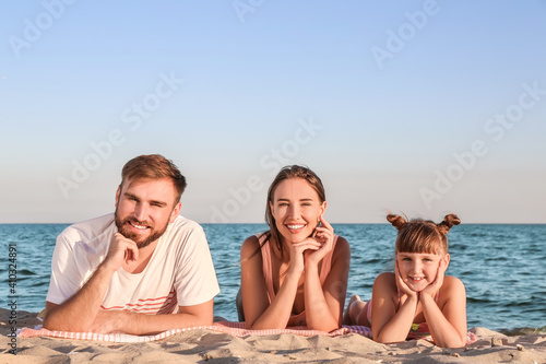 Happy family on sea beach