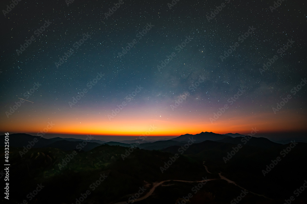 Panorama view universe space shot of milky way galaxy with stars on night sky background at mountains landscape Thailand