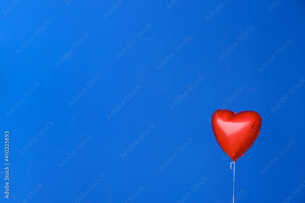Heart shaped air balloon on color background Heart shaped air balloon on color background