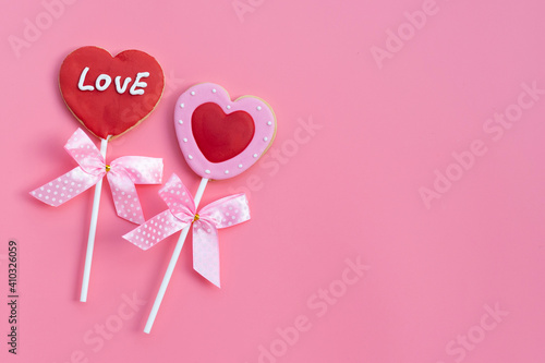 Valentineheart shapped cookies on pink background.  Copy space photo