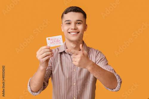 Teenage boy with gift card ...