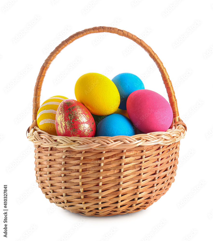 Basket with beautiful Easter eggs on white background