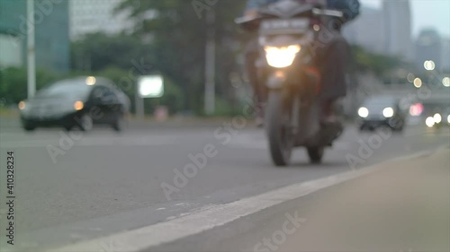 Blurred street traffic, daytime traffic time-lapse