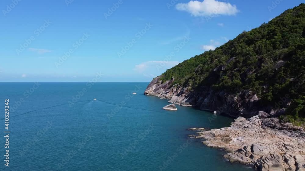 An aerial view of the coastline of a beautiful tropical island An aerial view of the coastline of a beautiful tropical island