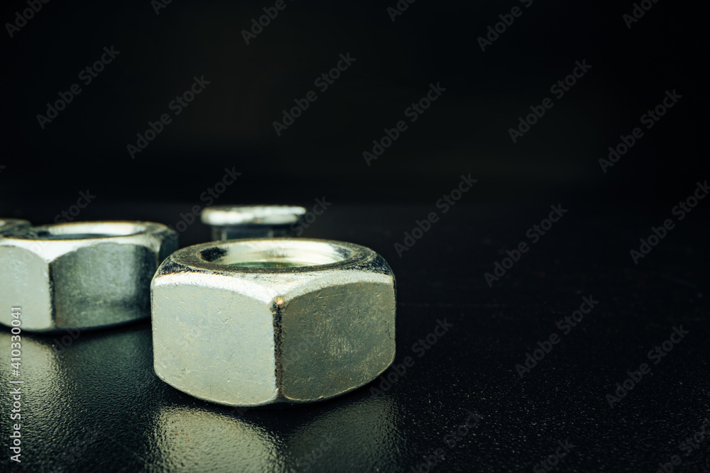 Metal nut on black background close up Metal nut on black background close up