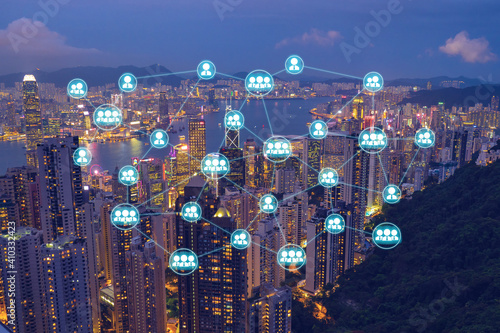 Wireless networking diagram over cityscape at night that represent the internet communication in worldwild. photo