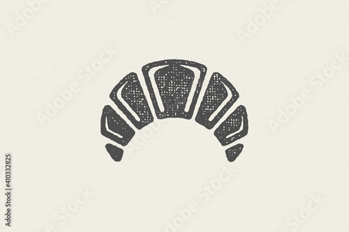 Black silhouette of freshly baked bun designed in retro style of bakery hand drawn stamp effect vector illustration.