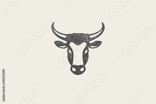 Black cow head silhouette with horns designed for meat industry hand drawn stamp effect vector illustration.
