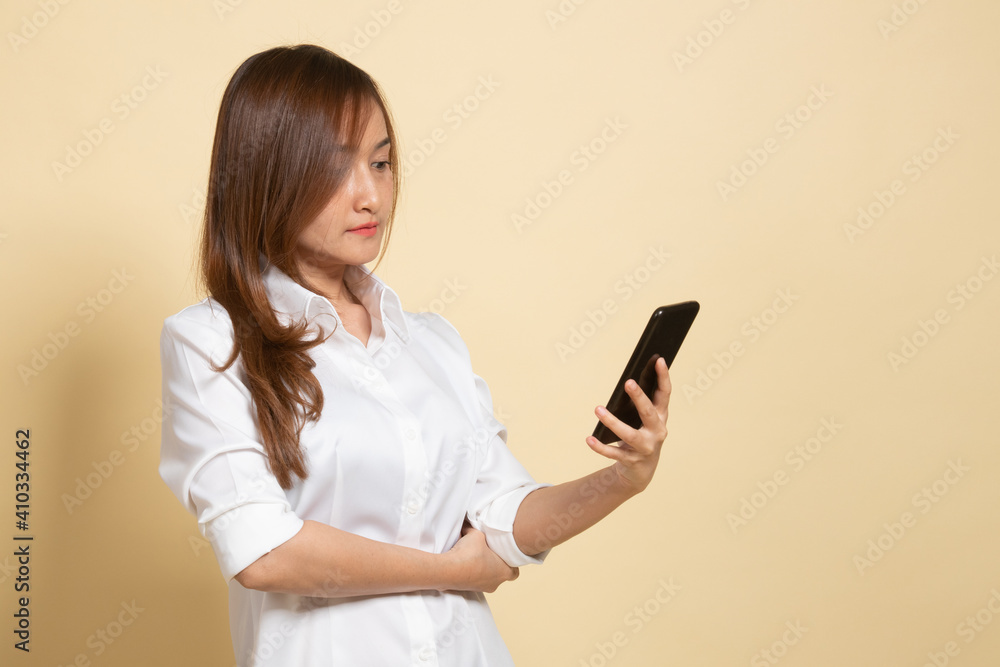 Young Asian woman with mobile phone. Young Asian woman with mobile phone.