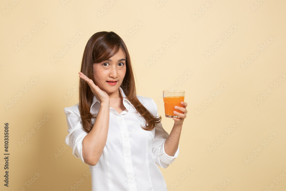 Happy Young Asian woman drink orange juice. Happy Young Asian woman drink orange juice.