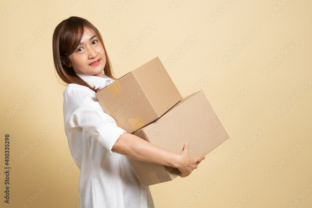 Delivery, relocation and unpacking. young asian woman holding cardboard box. Delivery, relocation and unpacking. young asian woman holding cardboard box.