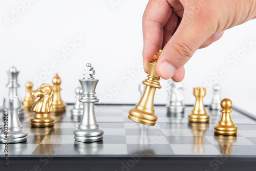 Plan leading strategy of successful business competition leader concept, Hand of player chess board game