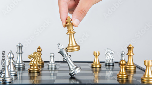 Plan leading strategy of successful business competition leader concept, Hand of player chess board game photo