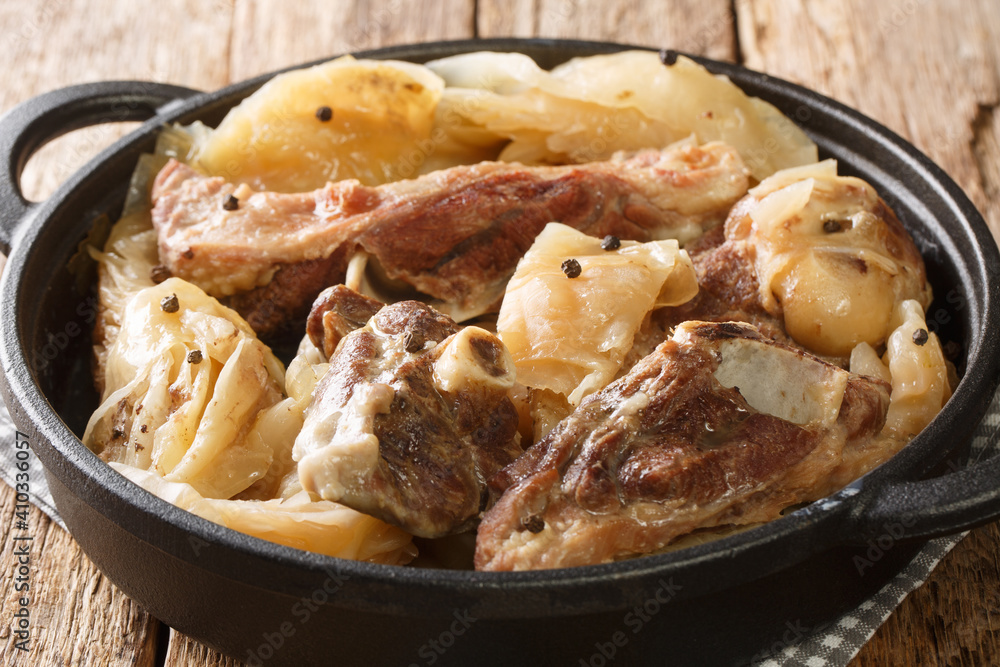Farikal Norwegian Lamb and Cabbage Stew close-up in a pan on the table. Horizontal Farikal Norwegian Lamb and Cabbage Stew close-up in a pan on the table. Horizontal