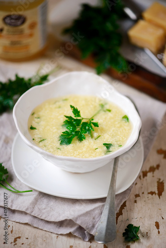 Strachatella soup..style vintage.selective focus