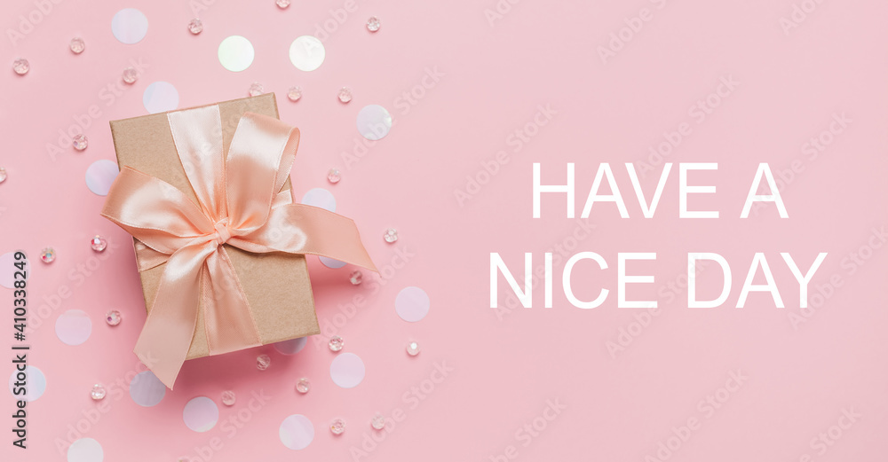 Gifts on pink background, love and valentine concept with text HAVE A NICE DAY