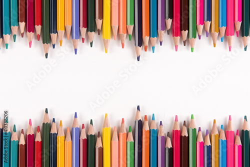 Color pencils array isolated on white background