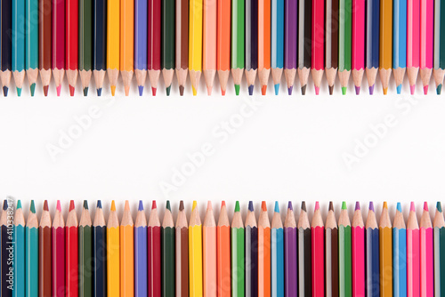 Color pencils array isolated on white background