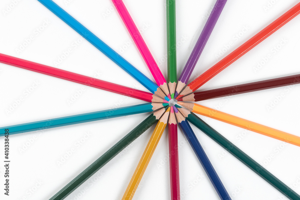 Circle made of colorful pencils on white background