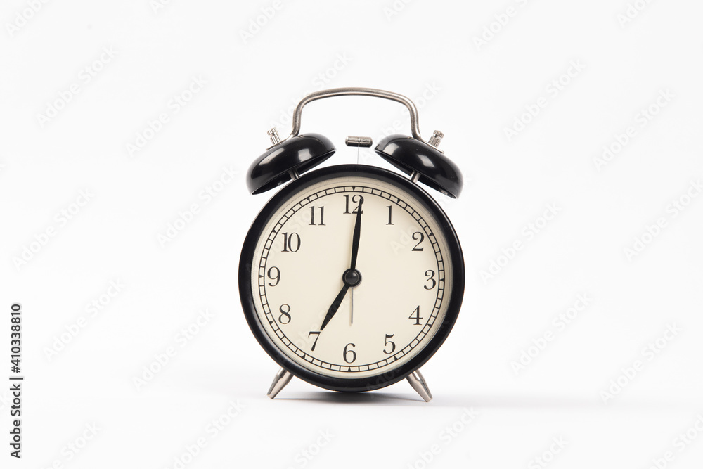Black retro alarm clock isolated on white background Black retro alarm clock isolated on white background