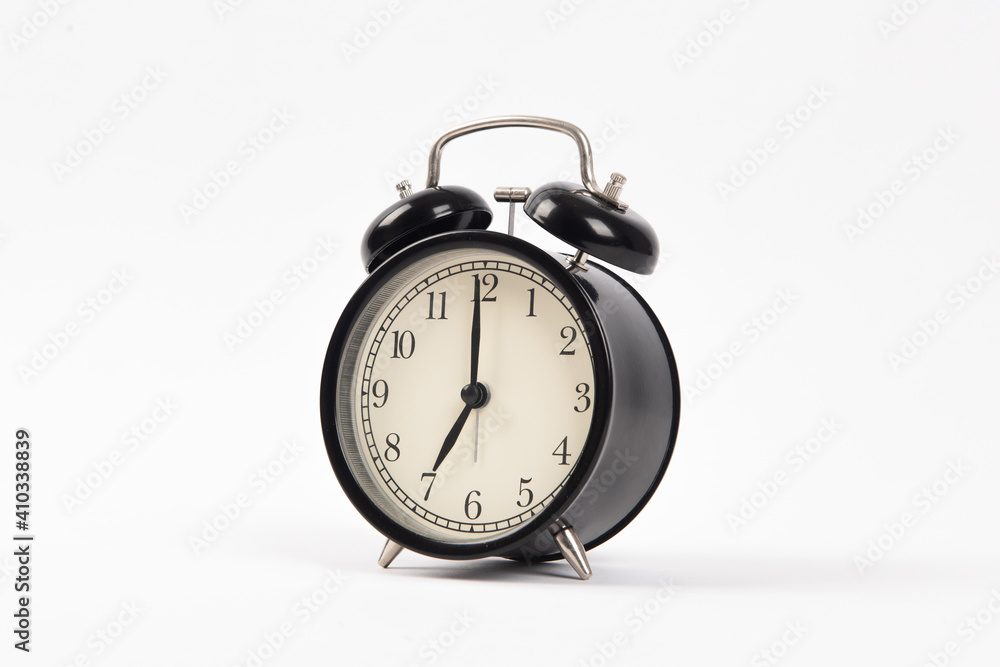 Black retro alarm clock isolated on white background Black retro alarm clock isolated on white background