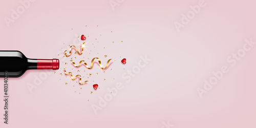 Red Wine bottle with gold ribbons and hearts, isolated  on pink background.