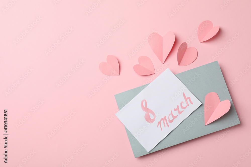 Card with text 8 march and hearts on pink background
