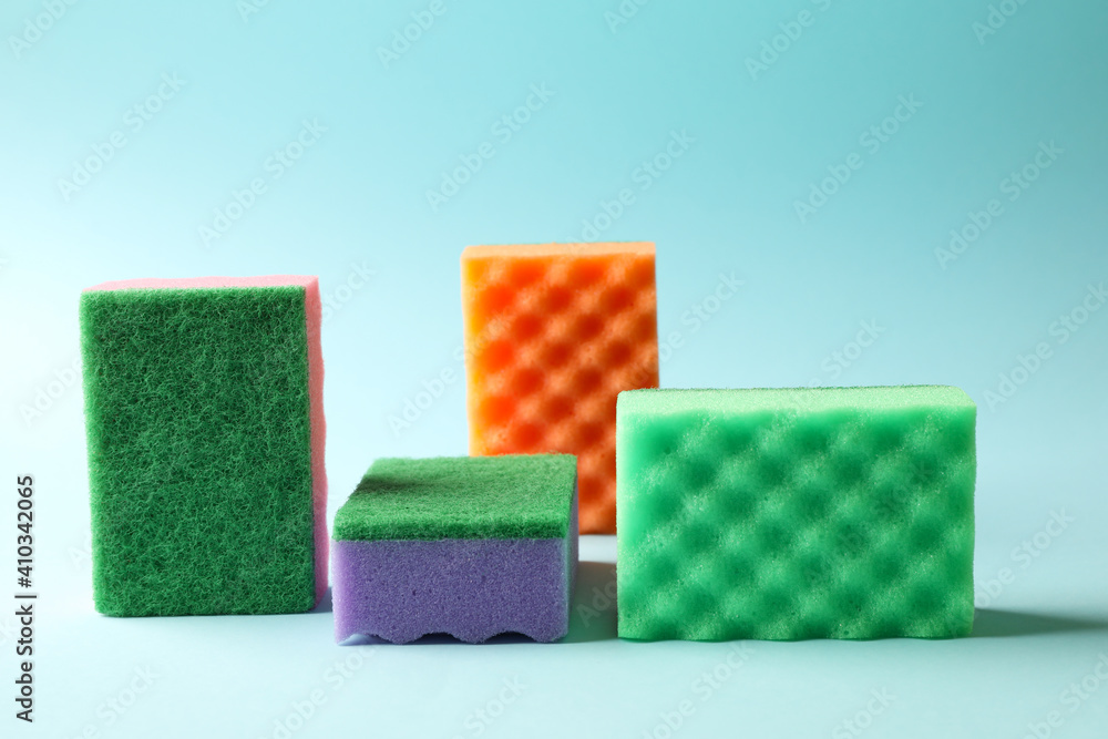 Obraz premium Color sponges for cleaning on blue background
