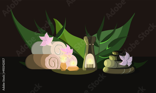 Spa kit. Towels, aroma lamp, candles, stones, flowers. Aroma therapy. Green leaf background