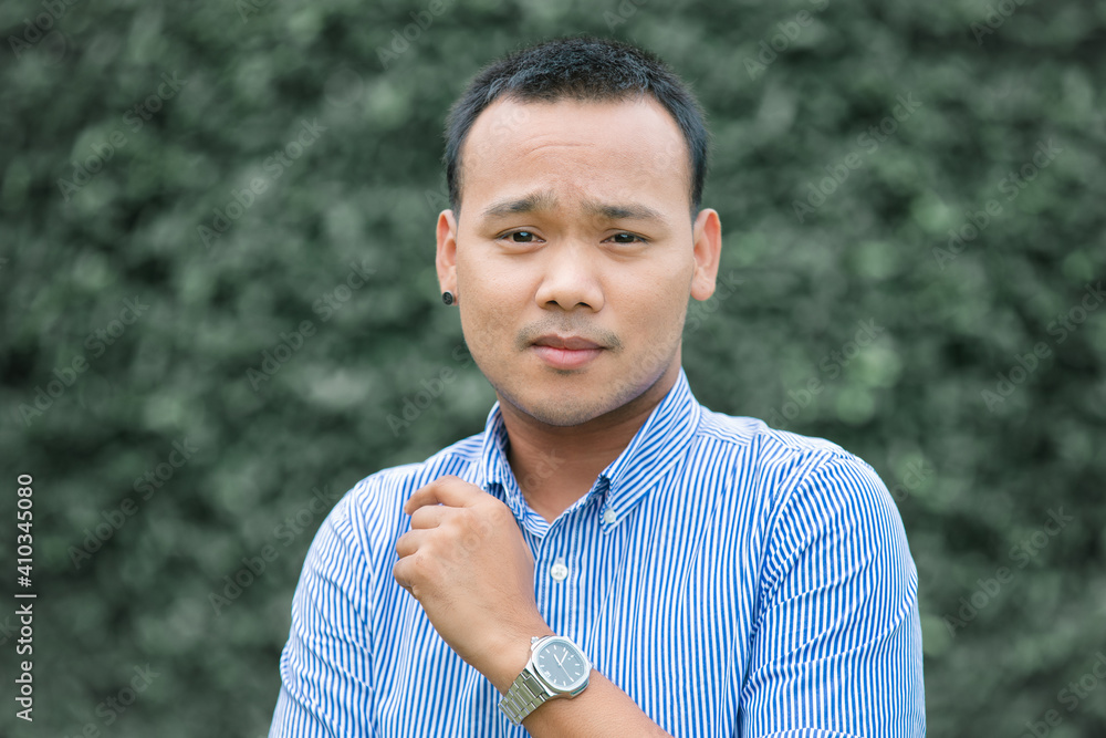 Close up Thai gay man on nature green blur background. Close up Thai gay man on nature green blur background.