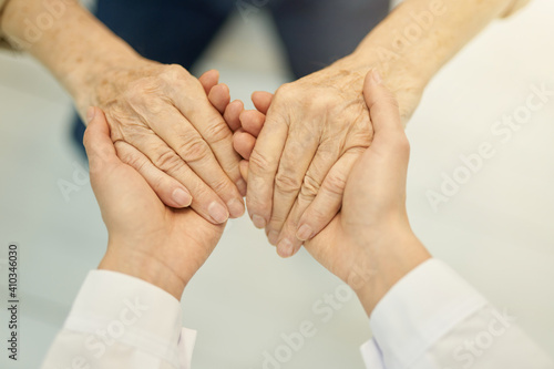 Fototapeta Naklejka Na Ścianę i Meble -  Cropped photo of two pairs of hands touching
