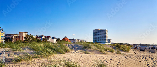 Photography Panorama from the Hotel Neptun and the city of Warnemünde behind the dunes on the Baltic Sea beach