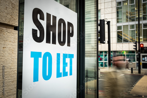 Shop To Let sign on high street window