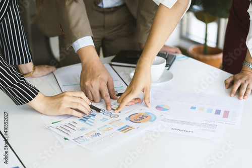 Hand of team, group young businessman,businesswoman people working marketing plan,discussing on paperwork with teamwork,colleagues at office,workplace.Brainstorm business concept.