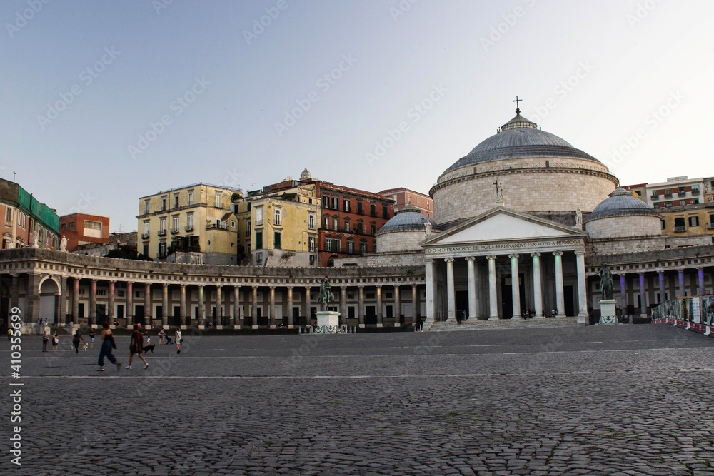Naples, Italy, June 26, 2020 evocative sunset image of Piazza del Plebiscito in neoclassical style with 
the Royal Papal Basilica in the background 
