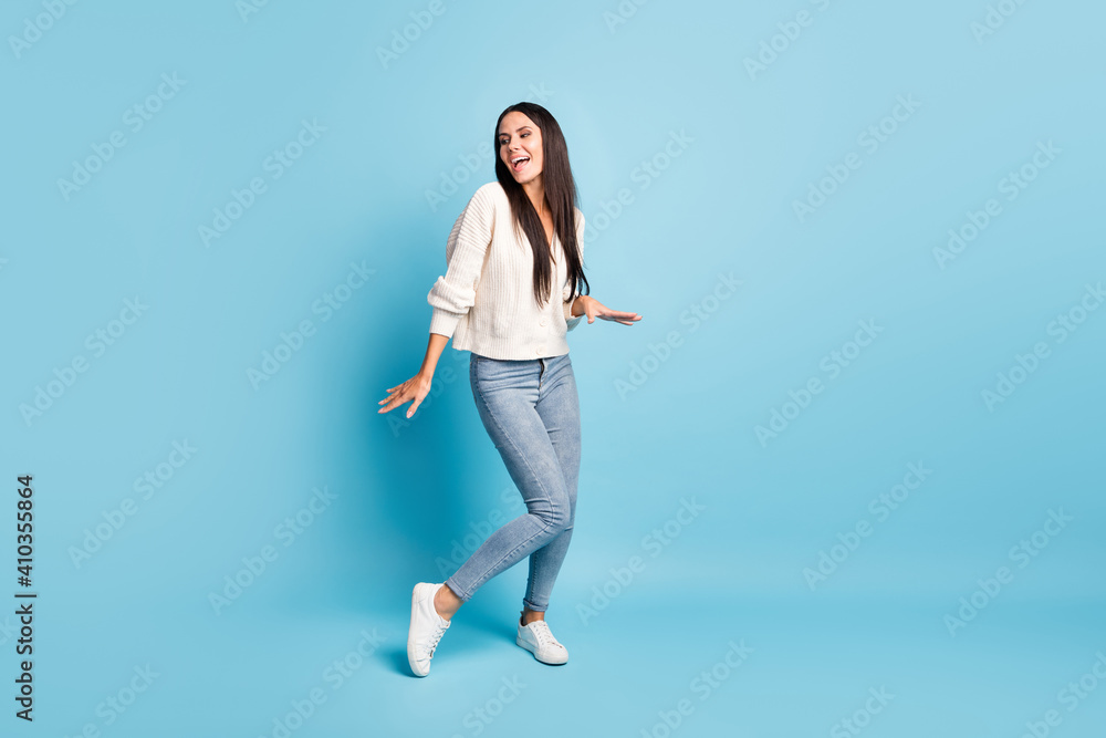 Full body portrait of cheerful charming girl dance clubbing enjoying vacation isolated on blue color background