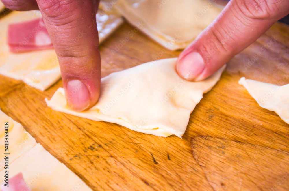 preparation of pretzels with cheese and mortadella cooked in the oven preparation of pretzels with cheese and mortadella cooked in the oven