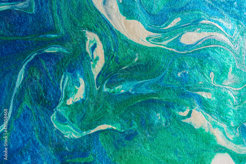 Turquoise blue abstract background in the technique of fluid art. liquid art pattern. Original art. Simulation of the depth of the ocean and the sea surface. Modern design. Drawing with acrylic paints