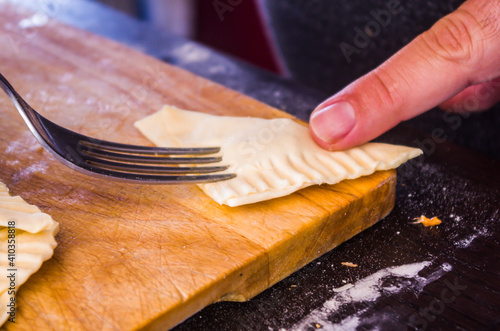 preparation of pretzels with cheese and mortadella cooked in the oven photo