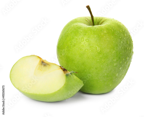 Fresh green cut and whole apples with water drops isolated on white