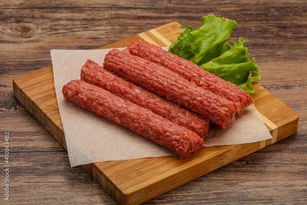 Raw beef sausages with spices Raw beef sausages with spices