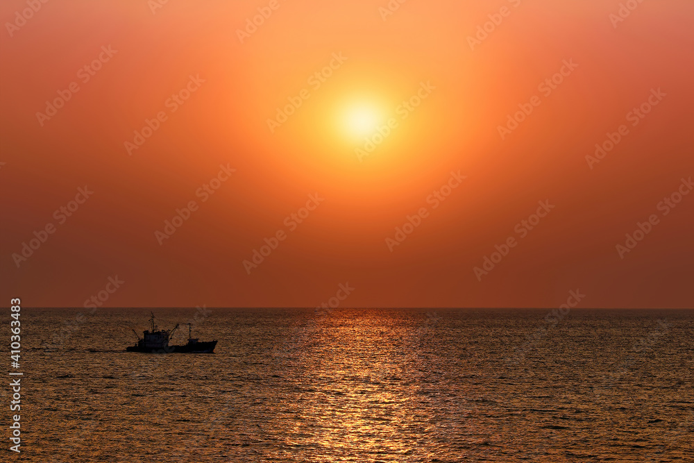 A magical bright orange sunset over the sea A magical bright orange sunset over the sea