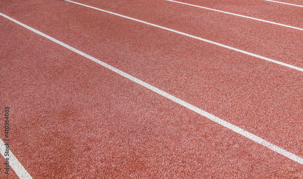 Close-up of the markings on the running track at the stadium. Close-up of the markings on the running track at the stadium.