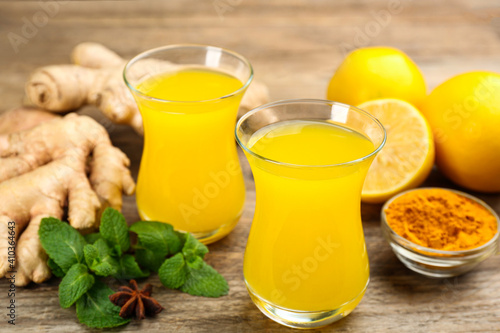 Immunity boosting drink and ingredients on wooden table