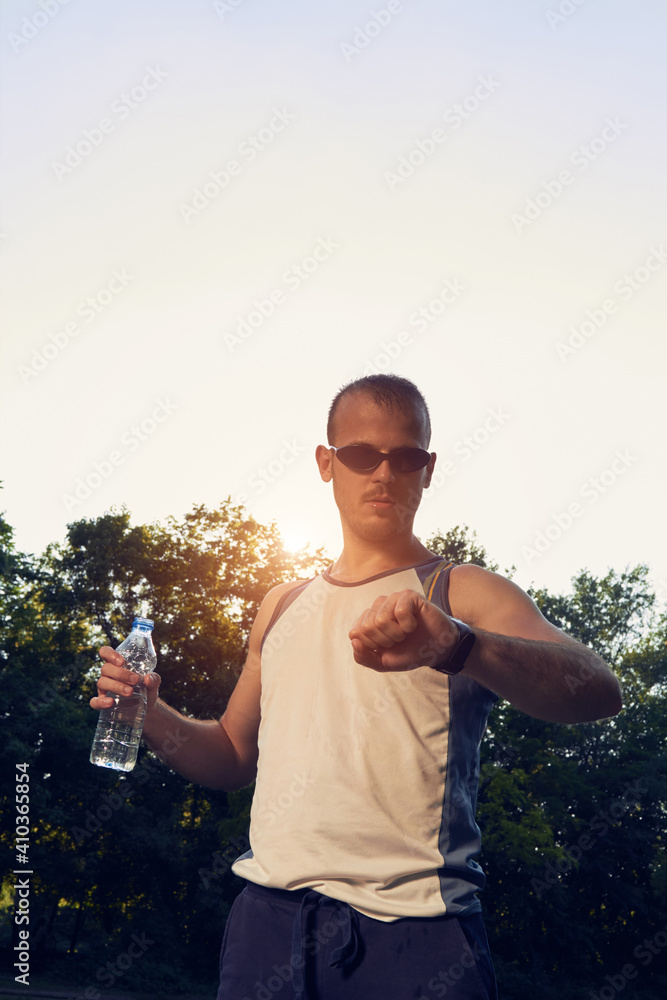 Fototapeta premium Sporty young adult man training in the park.