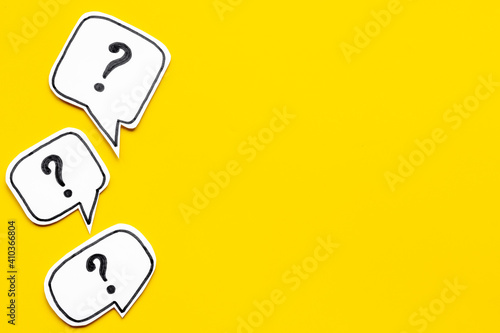 Ask question concept. Question mark on speech bubbles, top view