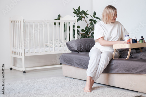 Close up 30s woman pours out from bottle pills time to take medicaments, cure for cholesterol level remedy pain killer drugs.