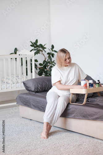 Close up 30s woman pours out from bottle pills time to take medicaments, cure for cholesterol level remedy pain killer drugs.