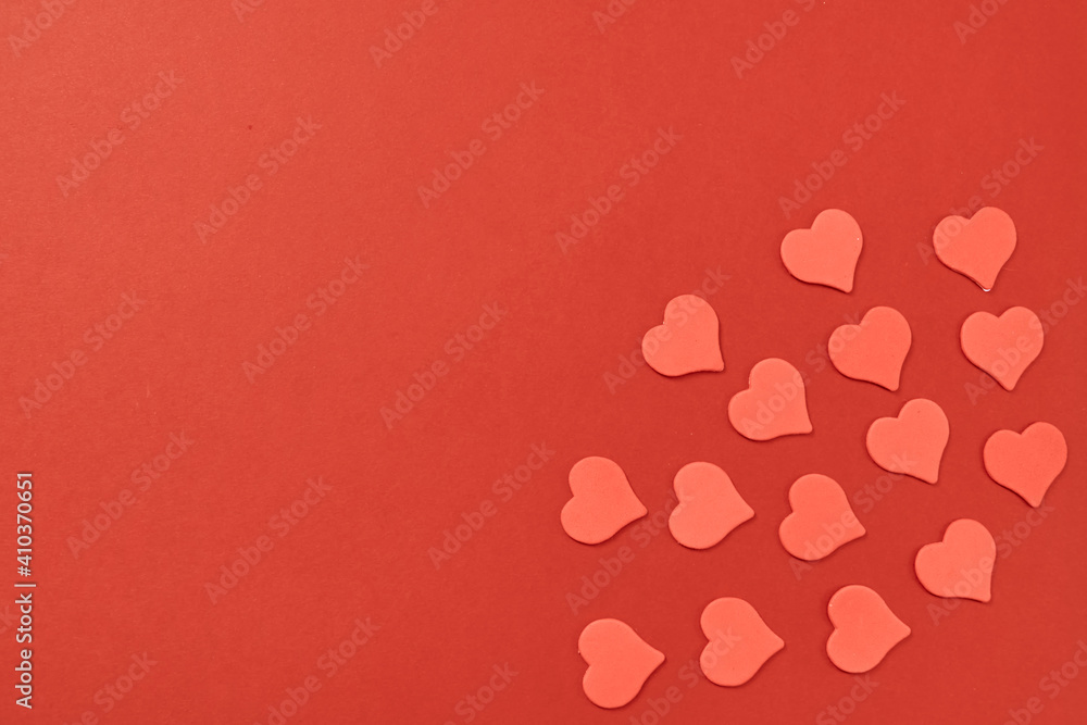 Red heart on a red background. Monochrome with a symphol of love for a card and a gift for the holiday of saint valentine. Postcard card for a date and a wedding. High quality photo