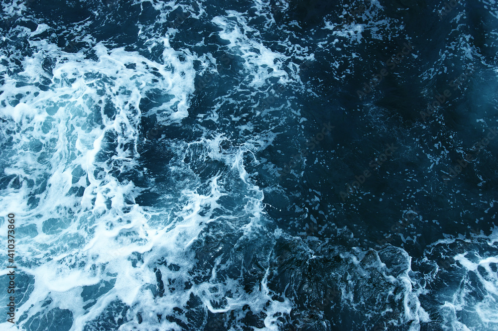 Abstract blue sea water with white wave